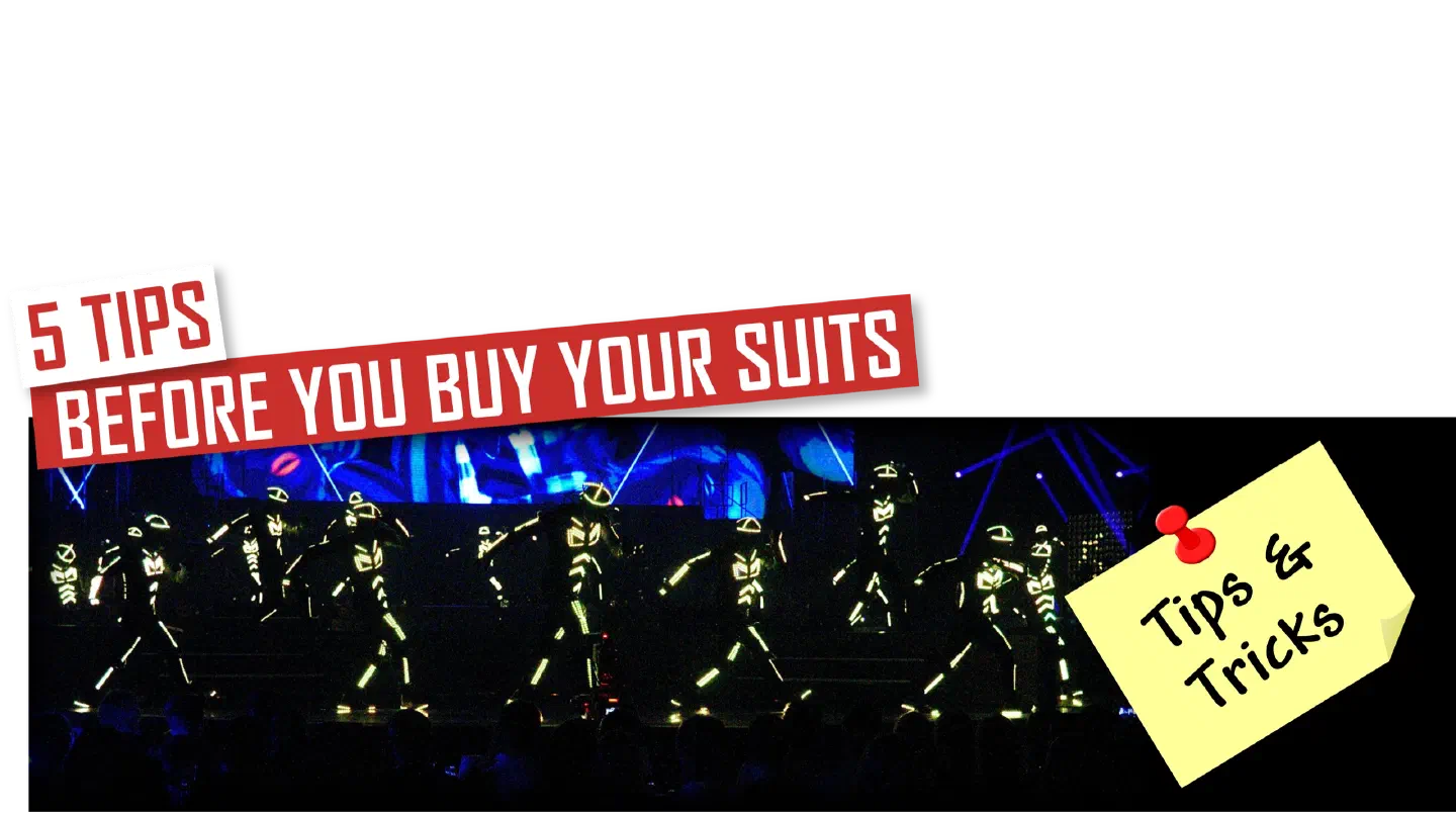 5 tips before you buy your suits – red and white banners above Tron dancers in glowing yellow-green LED suits on a stage, with a yellow “Tips & Tricks” note pinned beside them