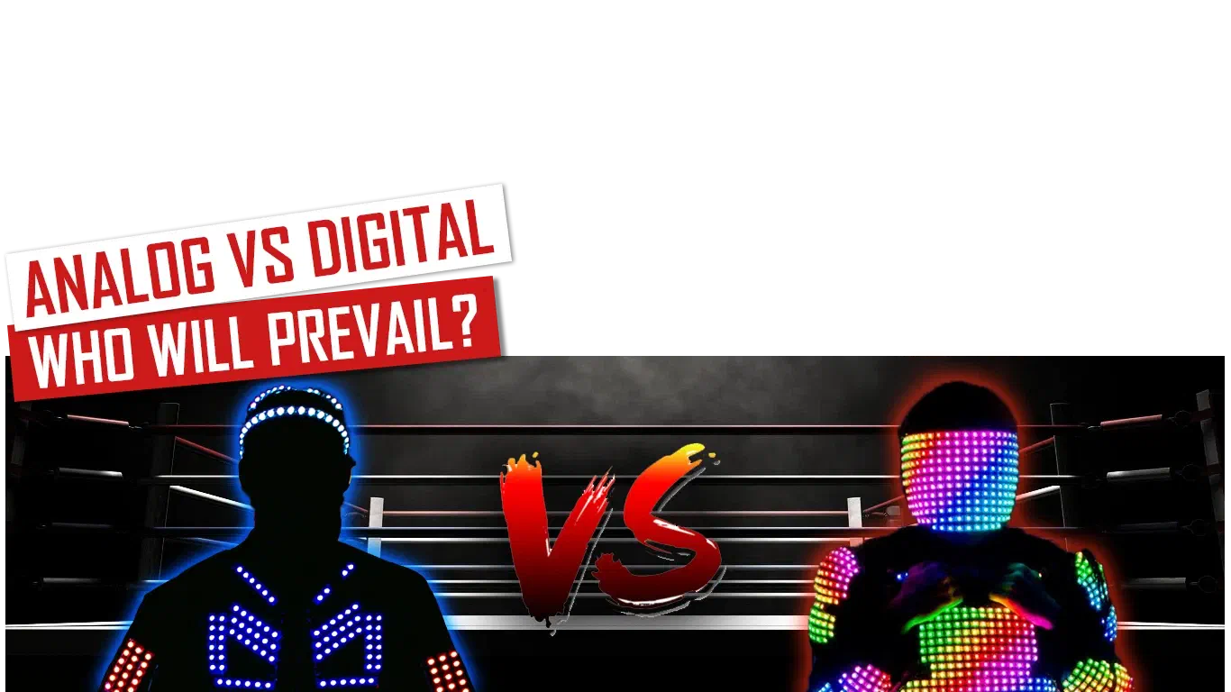 Analógové vs. digitálne – kto zvíťazí? – červeno-biele bannery nad dvoma tanečníkmi na opačných stranách boxerského ringu, jeden v LED kostýme s modrými analógovými LED segmentmi, druhý v kostýme pokrytom viacfarebnými pixelovými LED diódami, medzi nimi červené „VS“