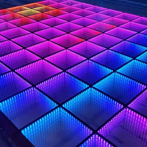 An infinity mirror LED dance floor – square glass tiles with tunnels of LEDs glowing red, pink, violet and blue
