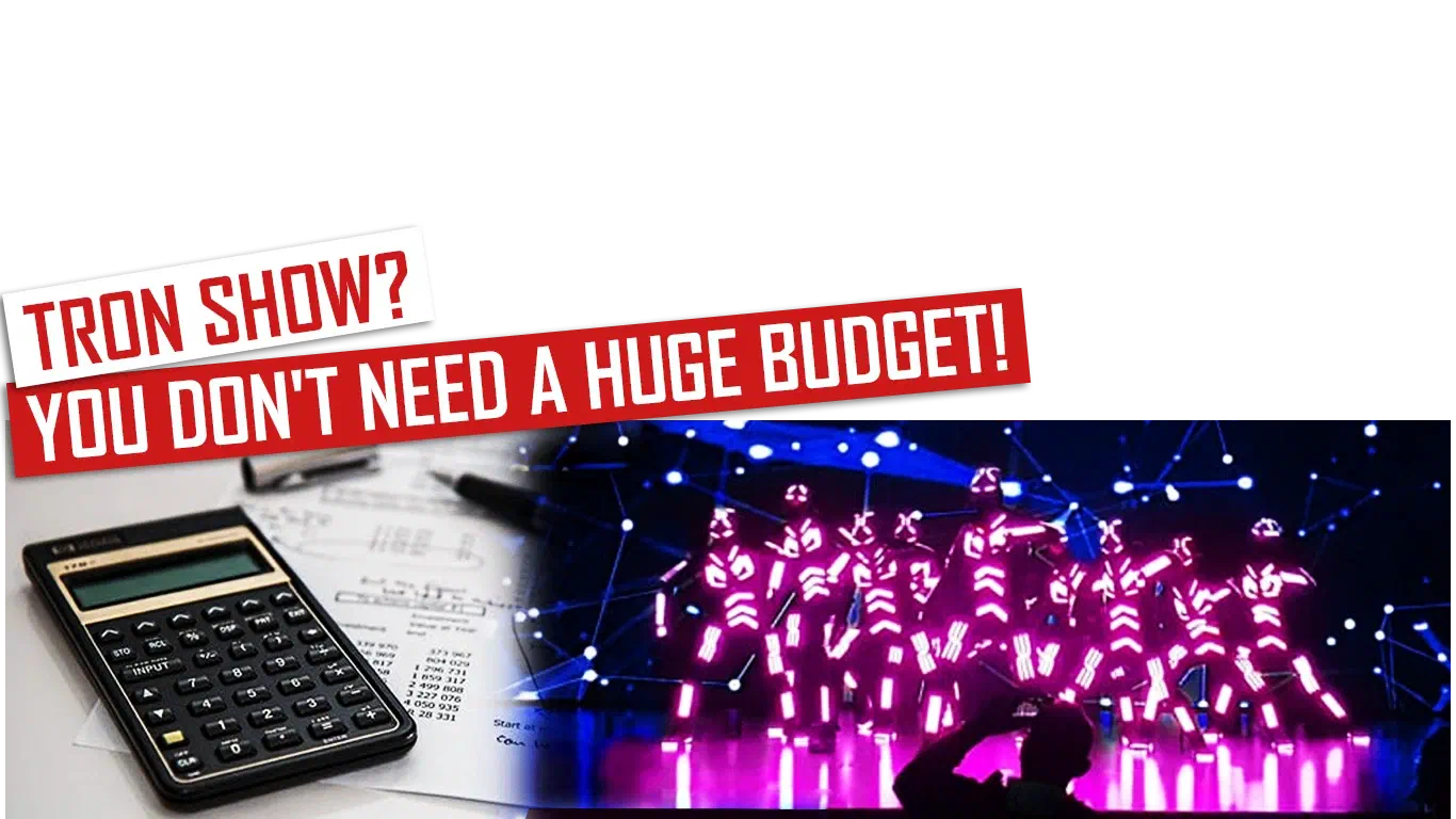 Tron show? You don’t need a huge budget! – red and white banners above a calculator on papers with figures, next to dancers in glowing pink LED suits on a stage under a net of blue lights