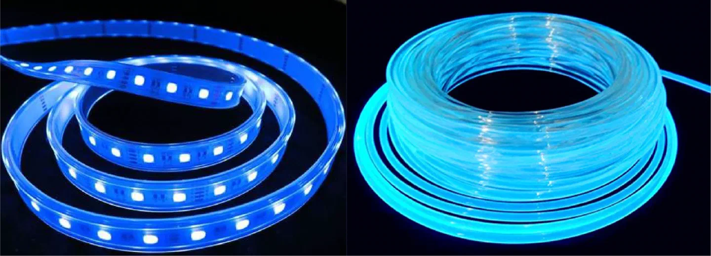 A coil of LED strip glowing blue next to a coil of fiber optic cable glowing light blue, on a black background