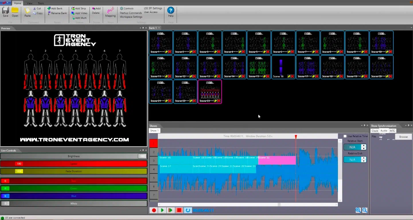 Screenshot of LED Strip Studio – a preview of seven LED suits under the Tron Event Agency logo, a bank of scenes and the show timeline with scenes placed over the waveform of the music