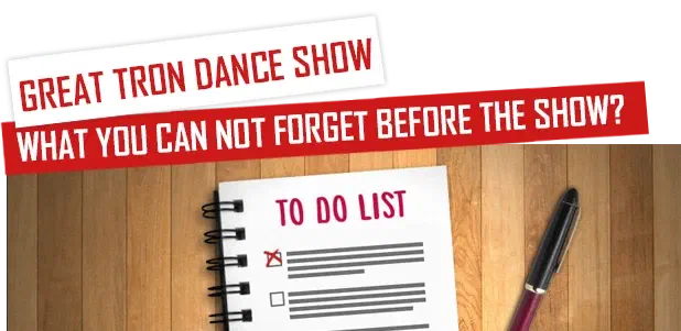 Great Tron Dance show – What you can not forget before the show? – a to-do list notepad with a ticked box and a pen on a wooden table