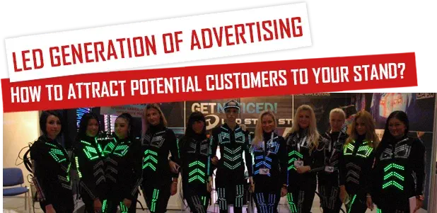 LED generation of advertising – How to attract potential customers to your stand? – red-and-white banners above a row of girls in black LED suits with glowing green chevrons at an exhibition stand