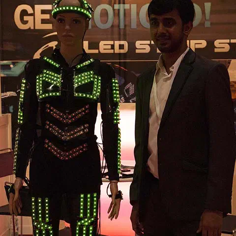 Girls in glowing LED suits handing out invitations and posing for pictures and selfies with visitors at the exhibition in Dubai – photo 16