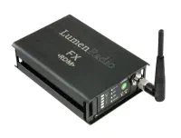 LumenRadio FX wireless DMX transceiver – a black metal box with a short antenna