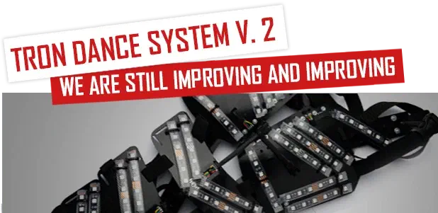 Tron Dance system v. 2 – we are still improving and improving – red and white banners above black plastic shells of an LED suit lined with LED strips
