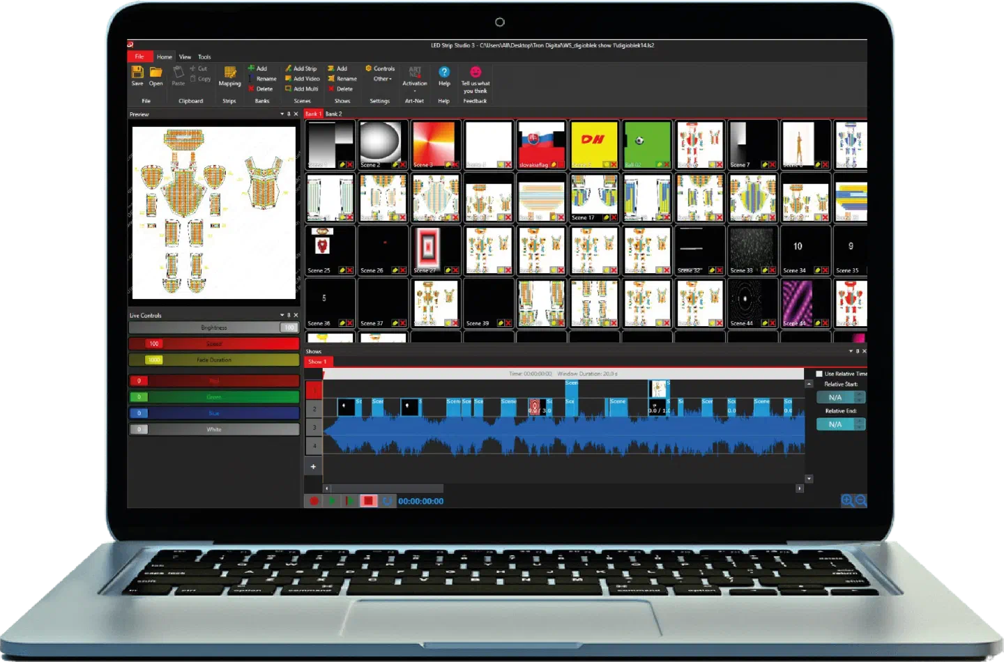 Laptop with LED Strip Studio 3 open – the preview of the pixel suit layout, Bank 1 with digital scenes such as a Slovak flag, a DHL logo and countdown numbers, and the show timeline over the music waveform