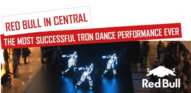 Red Bull in Central – the most successful Tron Dance performance ever – Tron dancers in glowing LED suits on a black dance floor in a shopping mall, with the Red Bull logo