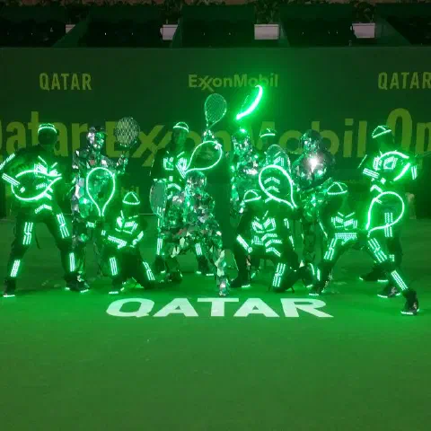 Qatar ExxonMobil Open 2016 opening ceremony – Tron dancers with glowing LED tennis rackets, the Mirror Family dancers and our team on the tennis court – photo 1