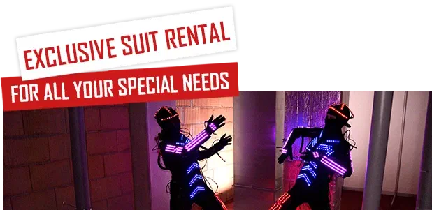 Exclusive suit rental – for all your special needs – red and white labels above two dancers in black LED suits with glowing pink and blue LED stripes