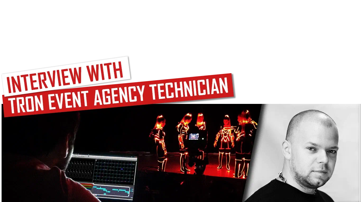 Interview with Tron Event Agency technician – red and white banners above a laptop with a show timeline in front of dancers in glowing orange LED suits being filmed on a dark stage, next to a black-and-white portrait of Patrick