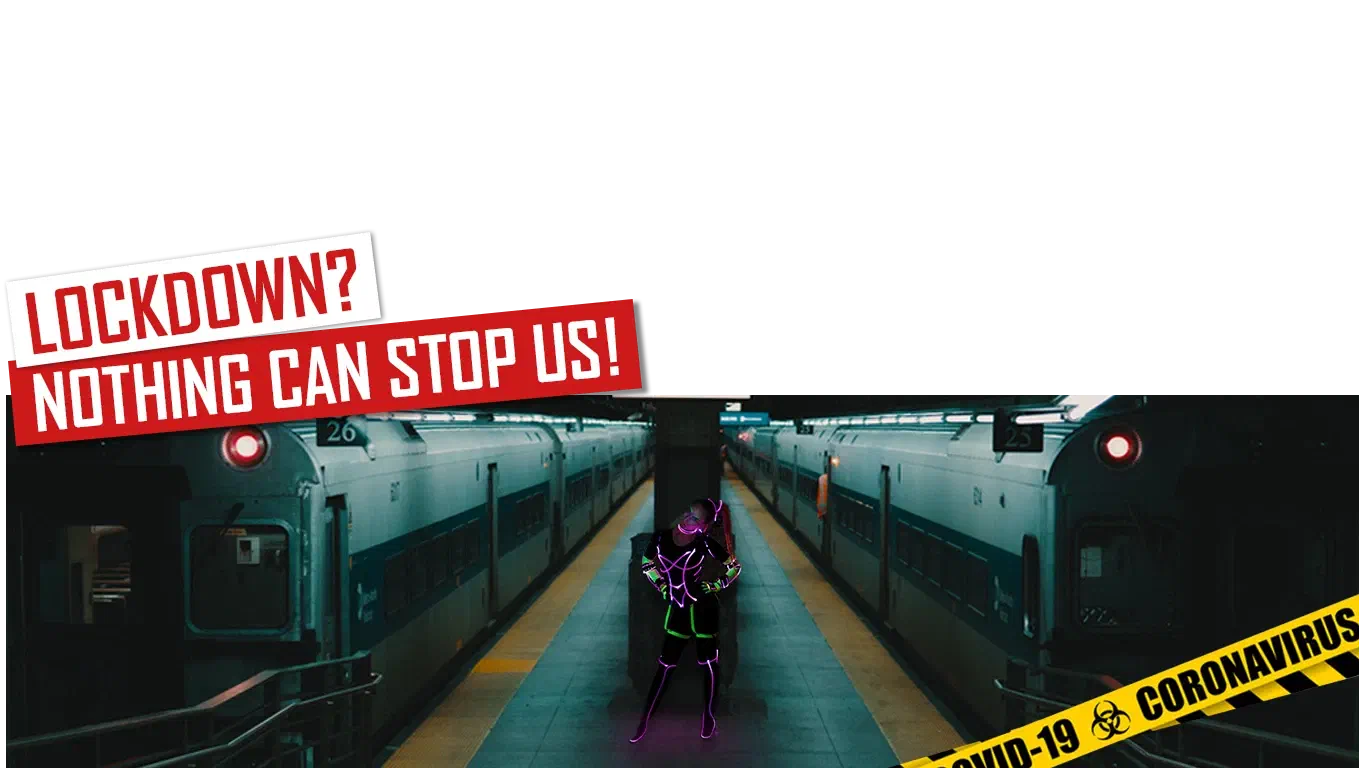 Lockdown? Nothing can stop us! – red and white banners above an empty subway platform between two trains, where a dancer in a black suit with glowing purple and green LED lines stands, with yellow COVID-19 coronavirus tape across the corner