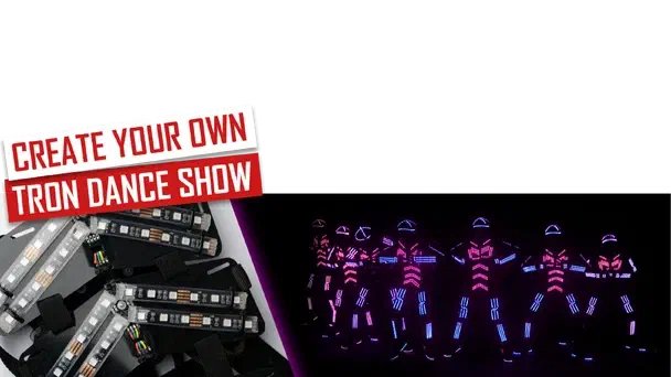 Create your own Tron Dance show – red and white banner above black LED suit parts with RGB LED strips, next to seven dancers in glowing pink and blue LED suits in the dark