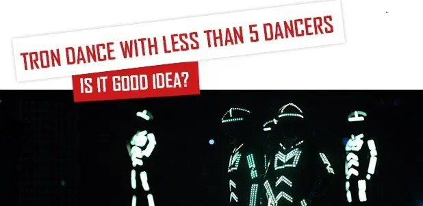 Tron Dance with less than 5 dancers – Is it good idea? – four Tron dancers in glowing white LED suits on a dark stage