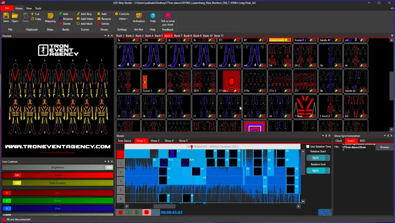 LED Strip Studio – the preview of two rows of seven numbered LED suits in red and yellow under the Tron Event Agency logo, banks of scenes and the show timeline over the music waveform