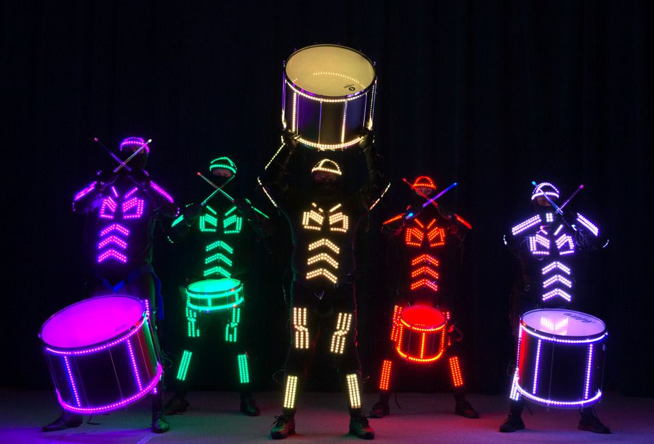 Tron Drummers in glowing LED suits with illuminated drums