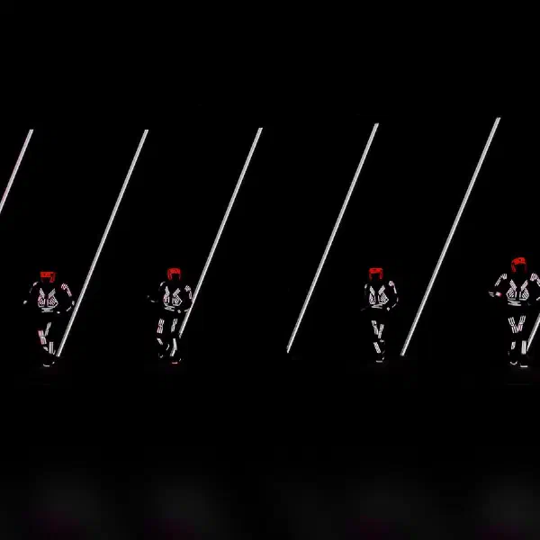Tron Dance Gen II: six LED dancers in red helmets between white diagonal light bars in an LED screen dance show