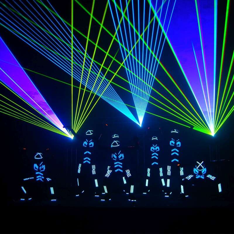 LED-suited performers on stage with colorful laser lights, showcasing high-tech event equipment used to create a visually stunning and immersive show experience